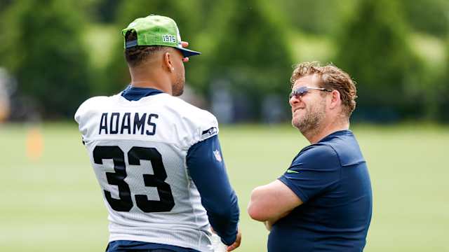 Seattle Seahawks strong safety Jamal Adams (33) talks with general manager John Schneider during minicamp practice at the Virginia Mason Athletic Center Field.